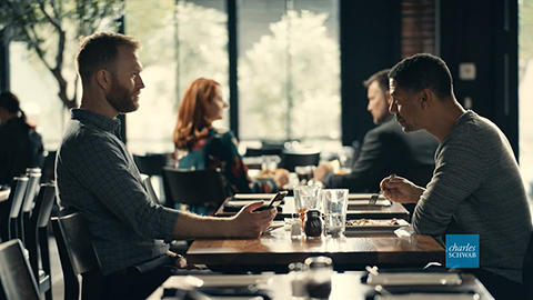 Two men at a table having a conversation