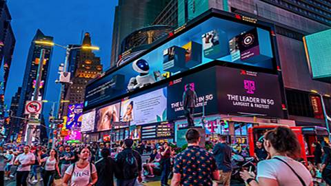 people in Times Square with Schwab outdoor billboard