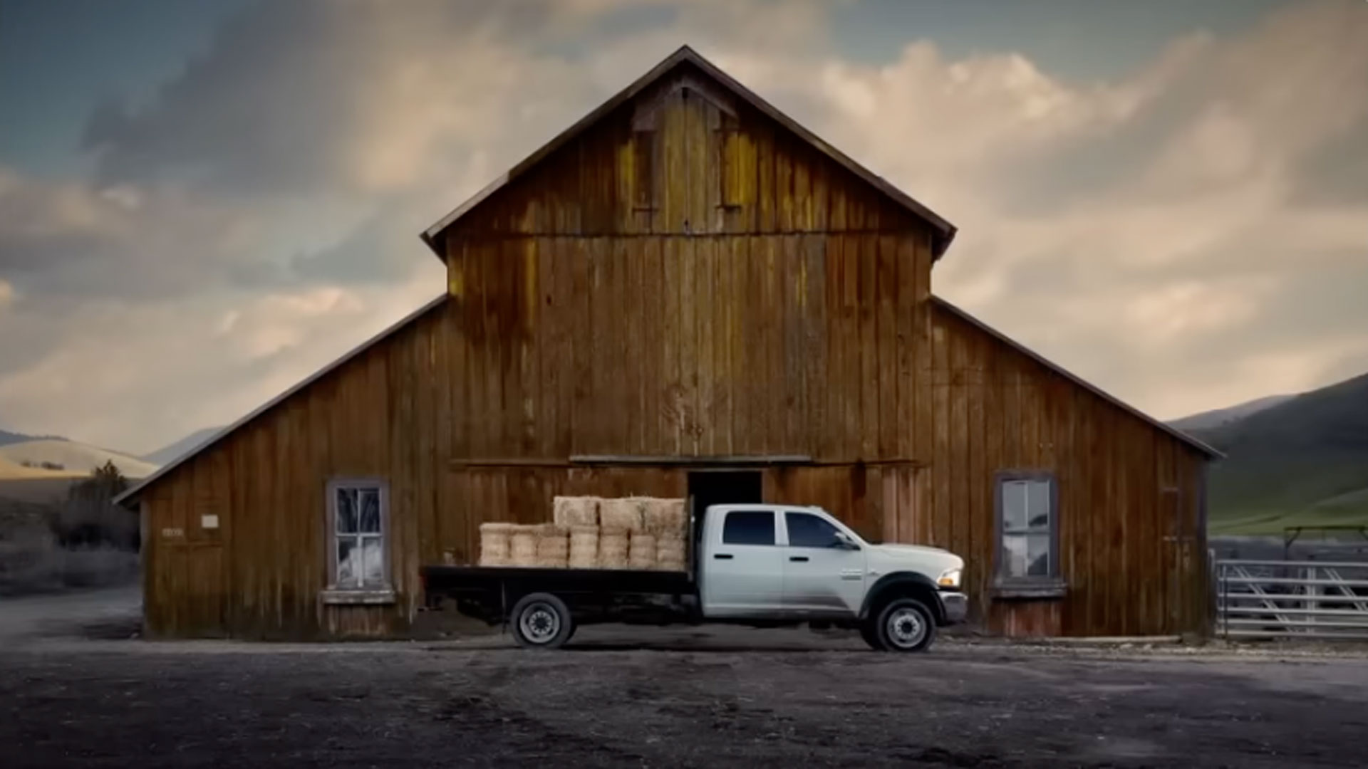 Truck in front of a barn