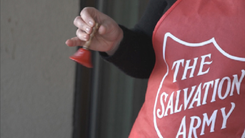 Closeup of Salvation Army worker ringing bell