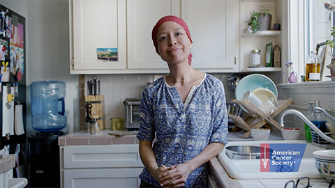Woman wearing a head scarf in a kitchen
