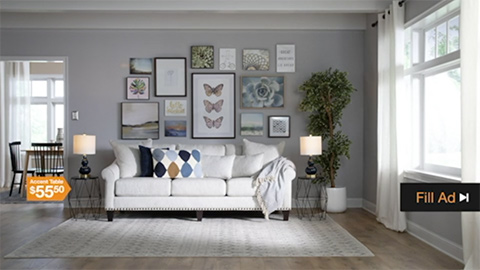 Living room showing couch and wall of pictures