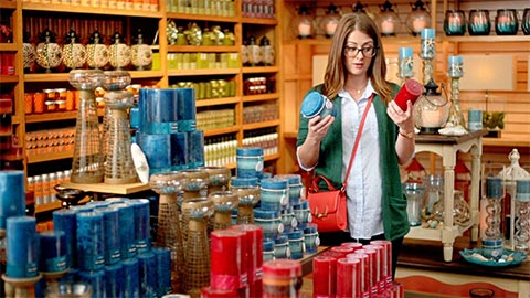 Woman looking at candles