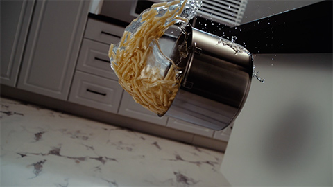 Pan of pasta falling onto Pergo flooring