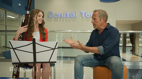 woman playing instrument with man