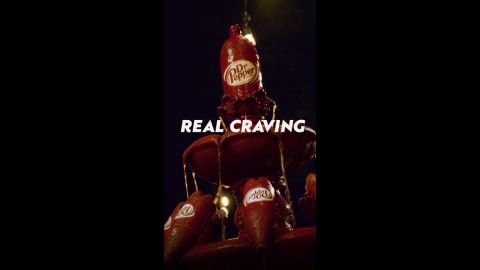 Fountain made of Dr Pepper with Real Craving superimposed on image