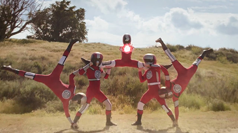 group of people dressed like superheroes doing tricks