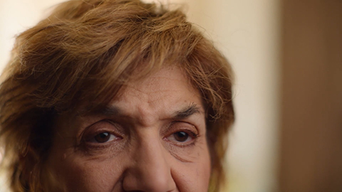 Closeup older woman's face with eyebrows raised