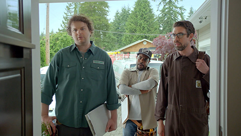 3 men standing outside someone's door