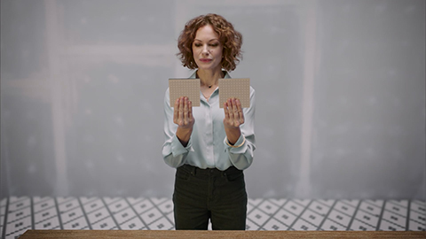 woman looking between two floor samples