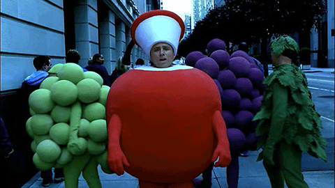 people dressed as apples and grapes