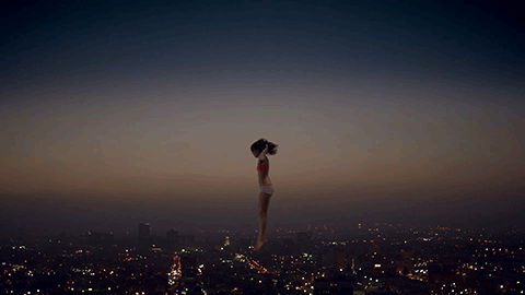 woman jumping in the sky