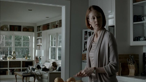 woman in kitchen looking over her shoulder